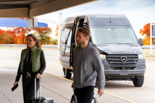 Photo of Two people traveling outside of a LandJet vehicle.