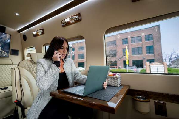 Photo of A woman working in a LandJet mobile office.